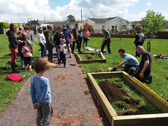 A group of green-fingered residents developing a community garden